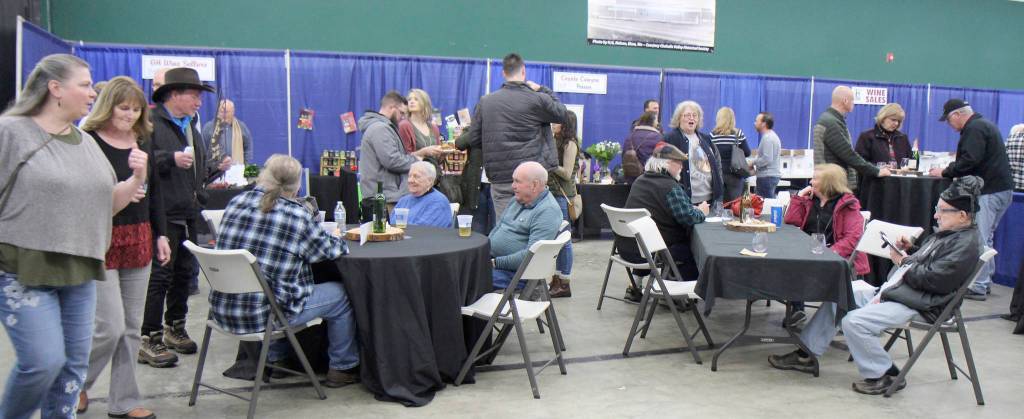 Michael Lang | Grays Harbor News Group                                 Attendees take a break Saturday during the Winter Wine Festival in Elma.