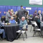 Attendees take a break Saturday during the Winter Wine Festival in Elma. (Michael Lang | Grays Harbor News Group)