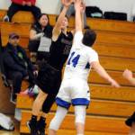 Montesanos Carter Olsen puts up a shot while under pressure from Elmas Noah Huttula on Wednesday at Elma High School. (Ryan Sparks | Grays Harbor News Group)                                Montesanos Carter Olsen puts up a shot while under pressure from Elmas Noah Huttula on Wednesday at Elma High School. (Ryan Sparks | Grays Harbor News Group)