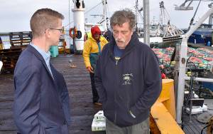 DAN HAMMOCK | GRAYS HARBOR NEWS GROUP                                Congressman Derek Kilmer, left, talks to Ocean Gold Seafoods Al Carter in Westport Friday morning as commercial crab boats prepare for todays season opener. Kilmer was in town to talk commercial and charter fishing with a group of charter, commercial, port and shellfish industry representatives.