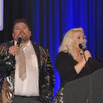 DAN HAMMOCK | GRAYS HARBOR NEWS GROUP                                Phil Luce and Logan Livingston served as auctioneer for the 12 live auction items offered at the United Way of Grays Harbor Black and White Gala fundraiser in Ocean Shores Saturday. Here they take bids for the Toes in the Water package, seven nights in Mexico.