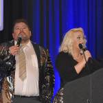 DAN HAMMOCK | GRAYS HARBOR NEWS GROUP                                Phil Luce and Logan Livingston served as auctioneer for the 12 live auction items offered at the United Way of Grays Harbor Black and White Gala fundraiser in Ocean Shores Saturday. Here they take bids for the Toes in the Water package, seven nights in Mexico.