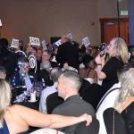 DAN HAMMOCK | GRAYS HARBOR NEWS GROUP                                During the Fund a Need portion of the Black and White Gala auction, attendees can donate at different levels toward United Way of Grays Harbors programs. Executive Director Kelley McDonald, with microphone, works the floor calling out bid numbers.