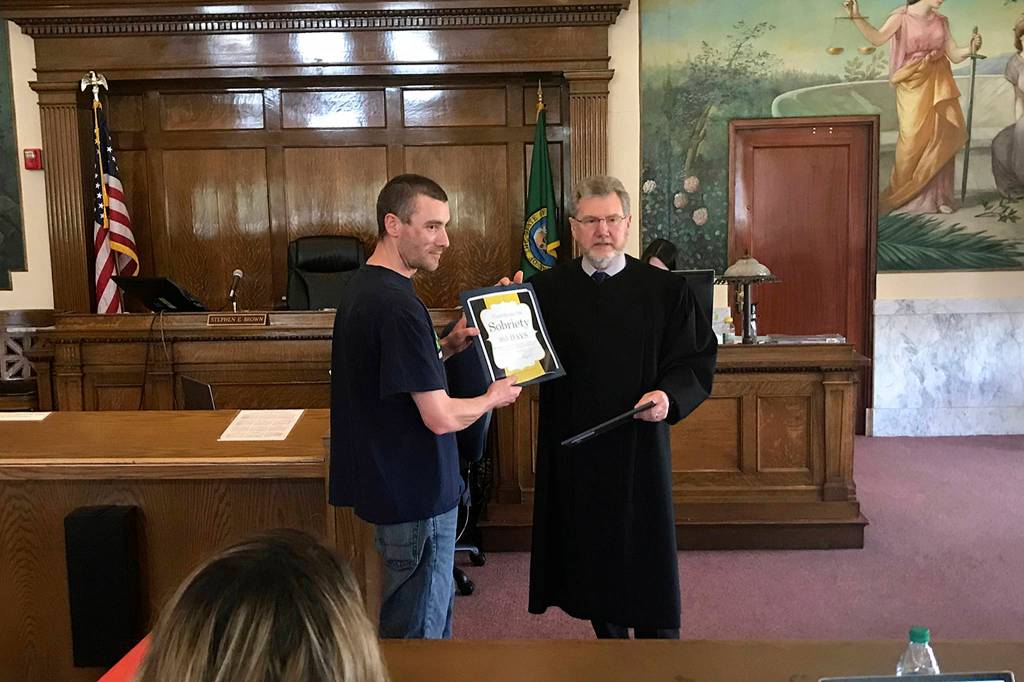 Louis Krauss | Grays Harbor News Group                                Brice Woods receives an award for 365 days sober in the Grays Harbor County drug court program.