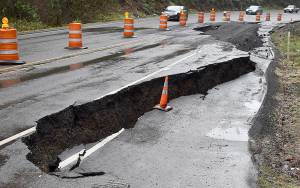 DAN HAMMOCK | GRAYS HARBOR NEWS GROUP                                Highway 101 on Cosi Hill has been down to one lane since this slide Jan. 24. The pavement has settled and cracked significantly since the initial slide. Department of Transportation crews have set up one-way alternating traffic at the slide, at milepost 78.8. There is no time frame for repair.
