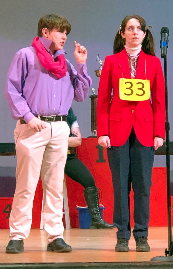 Logainne Schwartzandgrubenierre (Naomi Watkins) gets advice from her dad (Michael Turpin) on how to spell a word.