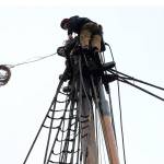 Kate Fournier and Bridget McCutchen swaying up the topgallant more than 50 feet above the deck of the Lady Washington on Thursday. (Thorin Sprandel | Grays Harbor News Group)