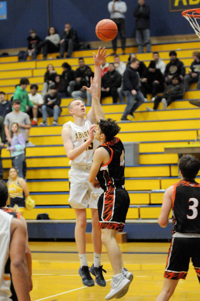 Aberdeens Kayden Seibert puts up a shot against Centralias Jason Baum during the Bobcats 61-49 victory on Tuesday in Aberdeen. (Ryan Sparks | Grays Harbor News Group)