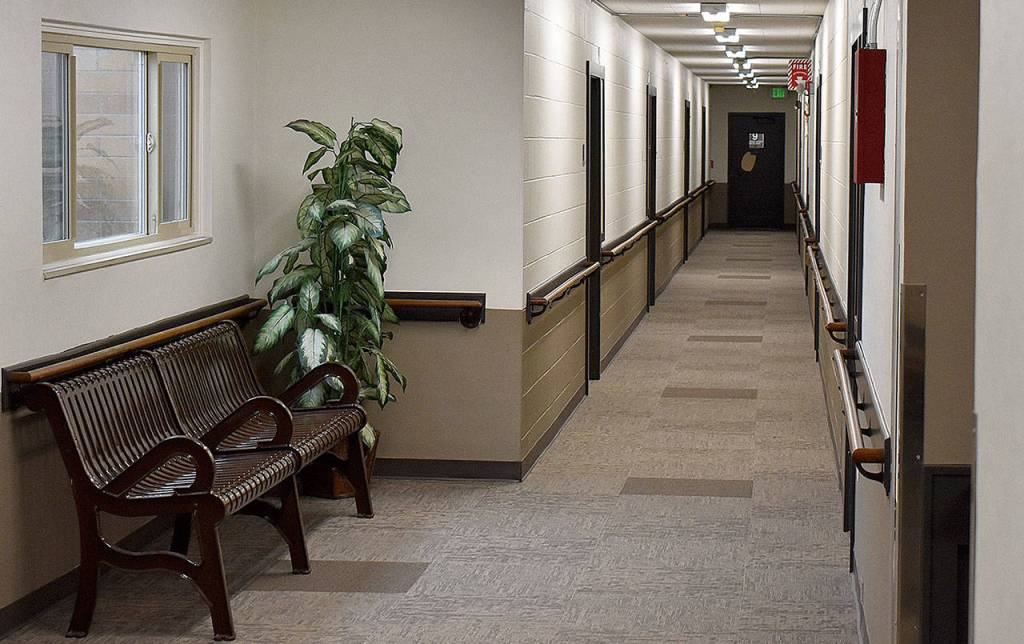 DAN HAMMOCK | GRAYS HARBOR NEWS GROUP                                 The walls of his hallway at Aberdeen Manor used to be all white. New flooring, a new two-tone paint job and energy efficient motion activated lighting are among the upgrades recently completed.