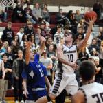 Montesanos Trace Ridgway (10) puts up an over-the-shoulder hook shot while Elmas Brady Johnston defends during the Bulldogs 70-61 victory on Thursday at Montesano High School. (Ryan Sparks | Grays Harbor News Group)