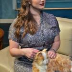 Gillian (Natasha Brown-Williams) strokes her familiar, Pyewacket, in Bell, Book and Candle.