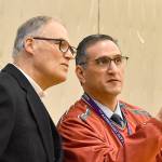 DAN HAMMOCK | GRAYS HARBOR NEWS GROUP                                 Hoquiam Superintendent Mike Villarreal, right, points out visiting students from the Quinault, Taholah and North Beach school districts to Gov. Jay Inslee at Hoquiam High School Wednesday.