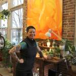 Trena Moore smiles while discussing her work Jan. 29, 2020, at her gallery, The Moore Gallery, in Montesano. The painting behind her recently sold for $5,400. (Michael Lang | Grays Harbor News Group.)