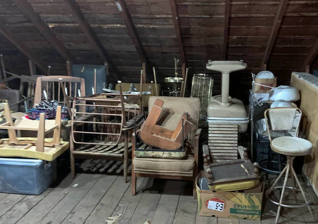 The attic level has plenty of floor space and room to walk upright, but its serving as a storage area for now.