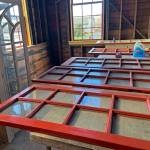 The original French doors from the second-story residence have been removed and repainted, and owner Ginger Mounts plans to build a balcony out there.