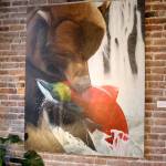 Michael Lang | Grays Harbor News Group                                A painting of a bear with a salmon in its mouth hangs on a wall at the Moore Gallery in Montesano.