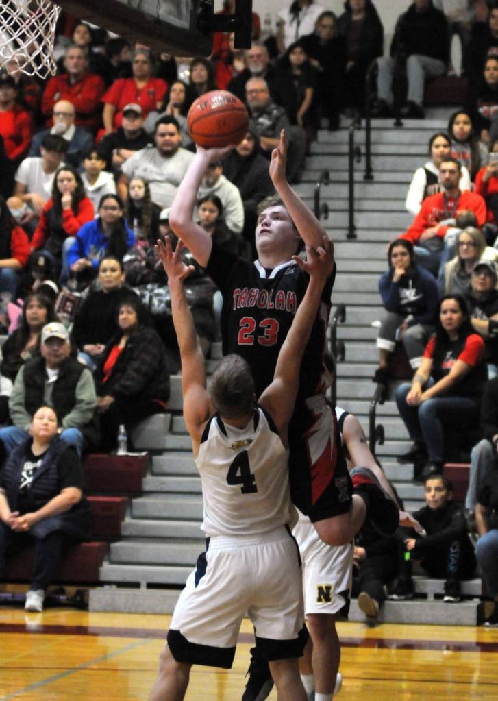Taholahs Izaian Mowitch rises for a jump shot while being defended by Naselles Ethan Lindstrom during the Chitwhins 58-53 victory in the 1B District 4 Championship game in Montesano. Mowitch scored 34 points to lead all scorers. (Ryan Sparks | Grays Harbor News Group)