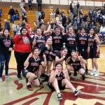 The Taholah Lady Chitwhins pose for a photo after defeating Naselle 50-40 in overtime of the 1B District 4 Girls Basketball Championship on Thursday in Montesano. (Ryan Sparks | Grays Harbor News Group)