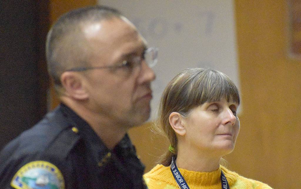 DAN HAMMOCK | GRAYS HARBOR NEWS GROUP                                 Miller Junior High Principal Lisa Griebel watches a video featuring incarcerated drug addicts produced by Aberdeen Police Officer Loren Neil. In the foreground is Aberdeen Police Chief Steve Shumate.