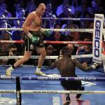 Tyson Fury, left, stops Deontay Wilder in their rematch to win the WBC World Heavyweight Championship at the MGM Grand Garden Arena in Las Vegas on Saturday. Fury knocked down Wilder in the third and fifth rounds before Wilders corner threw in the towel during the seventh round as referee Kenny Bayless stopped the fight. (Chris Farina | ZUMA Wire)