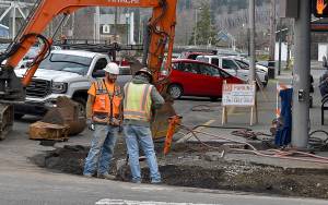 DAN HAMMOCK | GRAYS HARBOR NEWS GROUP                                 A crew from Rognlins Inc. tears out an ADA ramp at the corner of Seventh Street and Simpson Avenue in Hoquiam Tuesday morning, the first step in the Highway 101 sidewalks and paving project that began this week. Upgraded ADA sidewalk ramps will be installed as part of the $5.6 million Department of Transportation project.