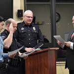 DAN HAMMOCK | GRAYS HARBOR NEWS GROUP                                 Hoquiam Mayor Ben Winkelman, right, swears in Hoquiam Police officers Israel Fernandez, left, and Stefan Green, second from left, at Mondays City Council meeting. Police Chief Jeff Myers introduced the two.
