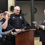 DAN HAMMOCK | GRAYS HARBOR NEWS GROUP                                 Hoquiam Mayor Ben Winkelman, right, swears in Hoquiam Police officers Israel Fernandez, left, and Stefan Green, second from left, at Mondays City Council meeting. Police Chief Jeff Myers introduced the two.