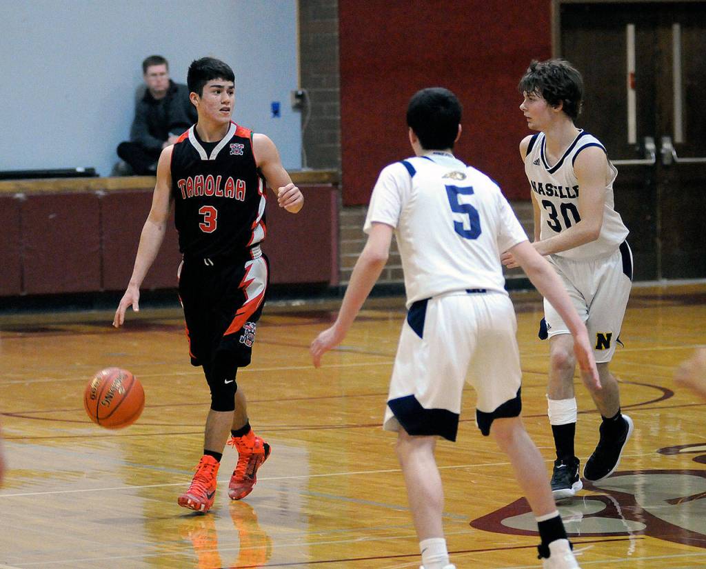 Taholah point guard James Orozco (3) dribbles against Naselle in the 1B District 4 championship game on Wednesday, Feb. 7 in Montesano. Orozco and the Chitwhins are ranked ninth heading into the regional round of the 1B State Tournament. (Ryan Sparks | Grays Harbor News Group)
