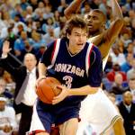 Gonzagas Adam Morrison drives by UCLAs Alfred Aboya for two-points during the first half of the NCAA regionals on Thursday, March 23, 2006, at the Oakland Arena in Oakland, California. (Karl Mondon/Contra Costa Times/KRT)