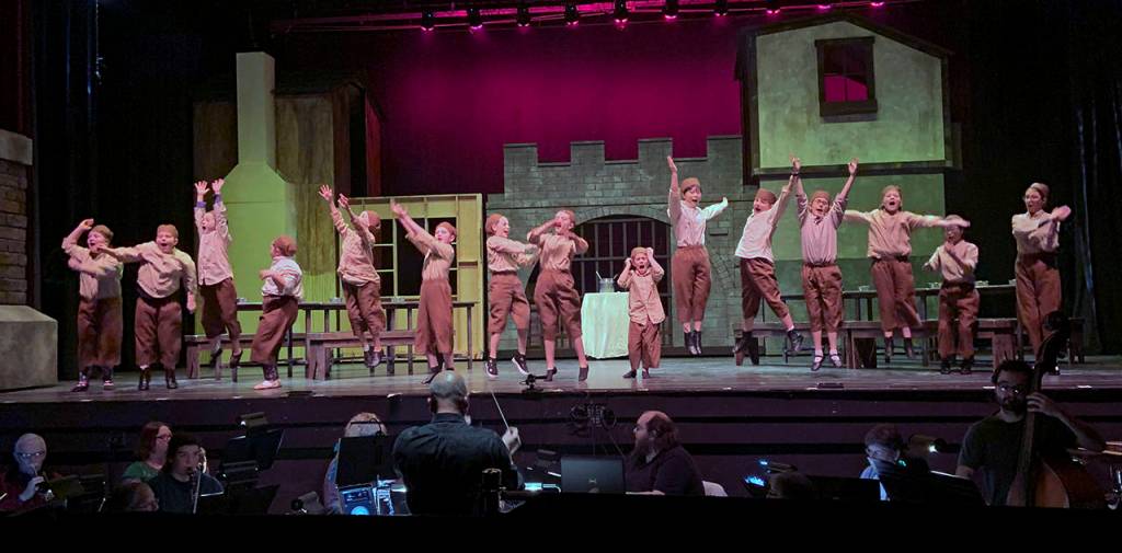 Photos by Kat Bryant | Grays Harbor News Group                                The orphans sing Food, Glorious Food as they await their dinner in the opening scene of Oliver, opening Friday at the Bishop Center.