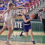Elmas Quin Mikel, right, drives the lane against Freemans Jordyn Goldsmith during the Eagles 49-25 loss in the first round of the 1A State Tournament on Wednesday at the SunDome in Yakima. (Photo by CJ Mudgett)