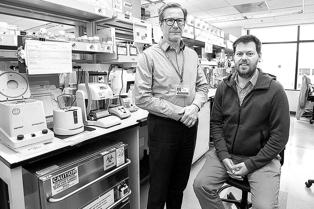 Dan DeLong/Kaiser Health News                                 Dr. Keith Jerome, left, director of the UW Medicine Virology laboratory in Seattle, and Dr. Alex Greninger, assistant director of the lab, quickly ramped up a test to detect the novel coronavirus, SARS-CoV-2. As of March 11, their lab had performed nearly 3,000 tests, with nearly 270 found to be positive.