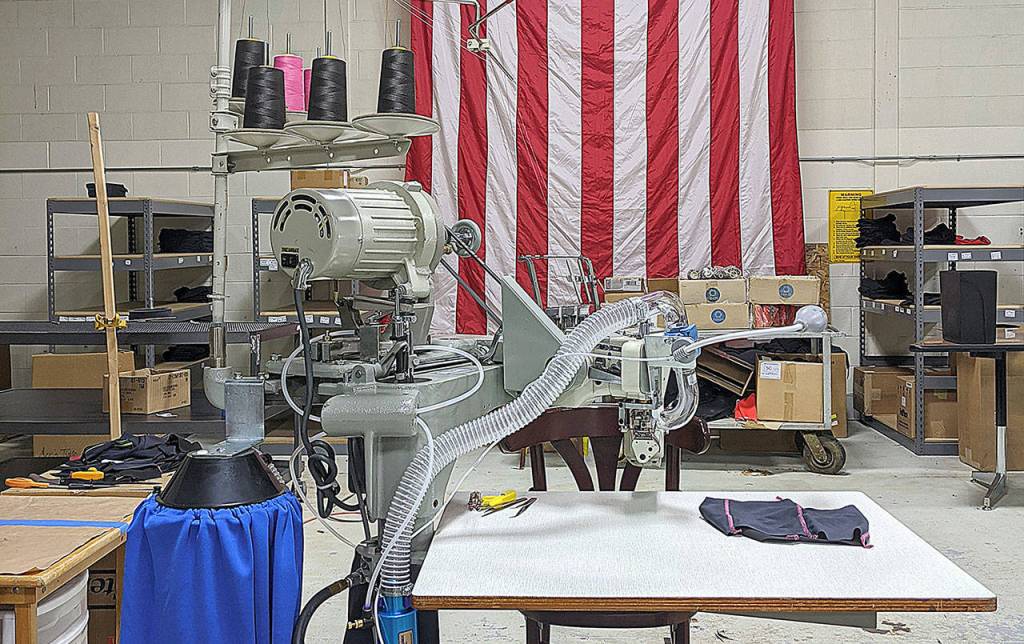 COURTESY BEN WINKELMAN                                 The machine Grays Harbor Unders took special delivery of Thursday to add to the line of machines already working. This machine was essential for the Hoquiam company to work with the different types of materials used for making masks for health professionals and first responders.