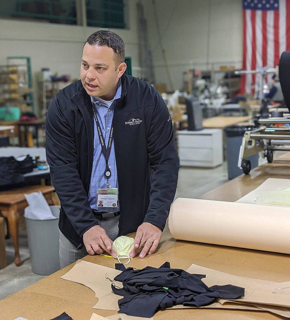 COURTESY BEN WINKELMAN                                 Josh Martin, CEO of Summit Pacific Medical Center, explains to Grays Harbor Unders textile professional Dara Gaddis and Vice President Ben Winkelman the use of disposable masks and the materials and assembly of masks Grays Harbor Unders has agreed to undertake.