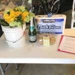 The couple celebrated with Safeway cookies and the host broke out his best white, plastic bucket for the flowers. The gift table included practical furnishings for the bathroom.