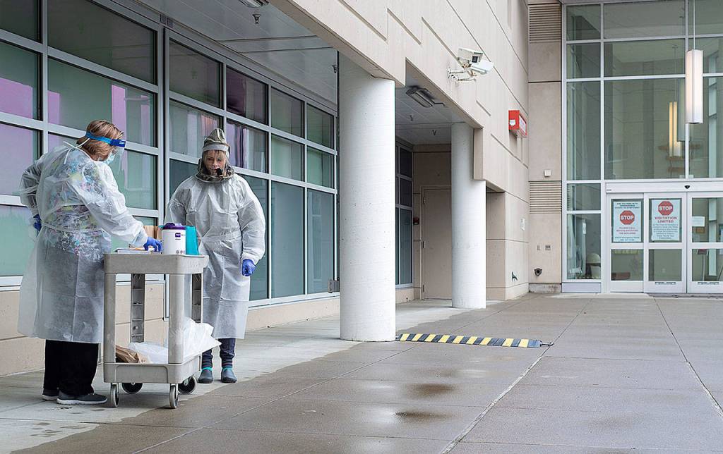 COURTESY GRAYS HARBOR COMMUNITY HOSPITAL                                Grays Harbor Community Hospital Chief Nursing Officer Melanie Brandt, left, and RN Chrissy Boice stand ready to administer drive through COVID-19 tests.