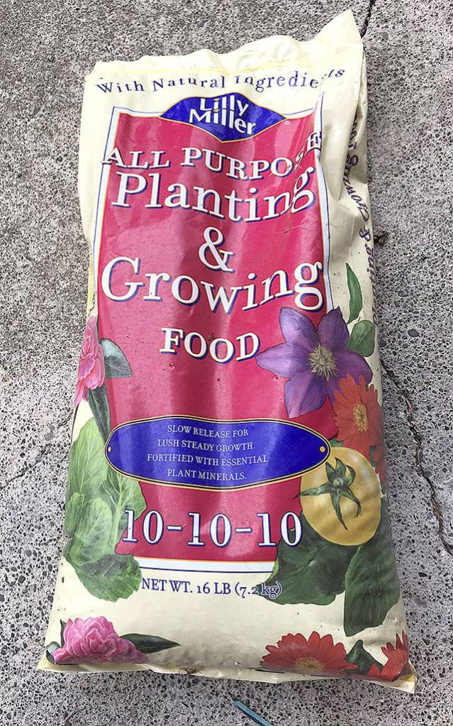 The three numbers on this all-purpose fertilizer bag show the contents comprise equal parts of nitrogen, phosphorus and potassium. This mixture is often used in early spring to promote all-around growth for shrubs and trees. However, for newly planted tomatoes, the better combination would be 5-10-10  not as much nitrogen.