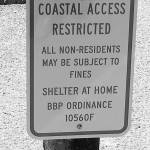 A sign warns outsiders to stay away from the beaches in Bolinas, California. (Maura Dolan/Los Angeles Times)