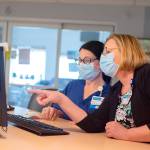 Melanie Brandt, right, chief nursing officer of Grays Harbor Community Hospital, consults with Registered Nurse Kristin Jennings.