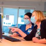 Melanie Brandt, right, chief nursing officer of Grays Harbor Community Hospital, consults with Registered Nurse Kristin Jennings.