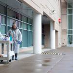 Melanie Brandt, left, chief nursing officer of Grays Harbor Community Hospital, takes a turn at one of the hospitals entrance screening stations with Registered Nurse Chrissy Boice.