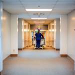 Nurse Trish Cornett wheels a patient through the halls at GHCH.