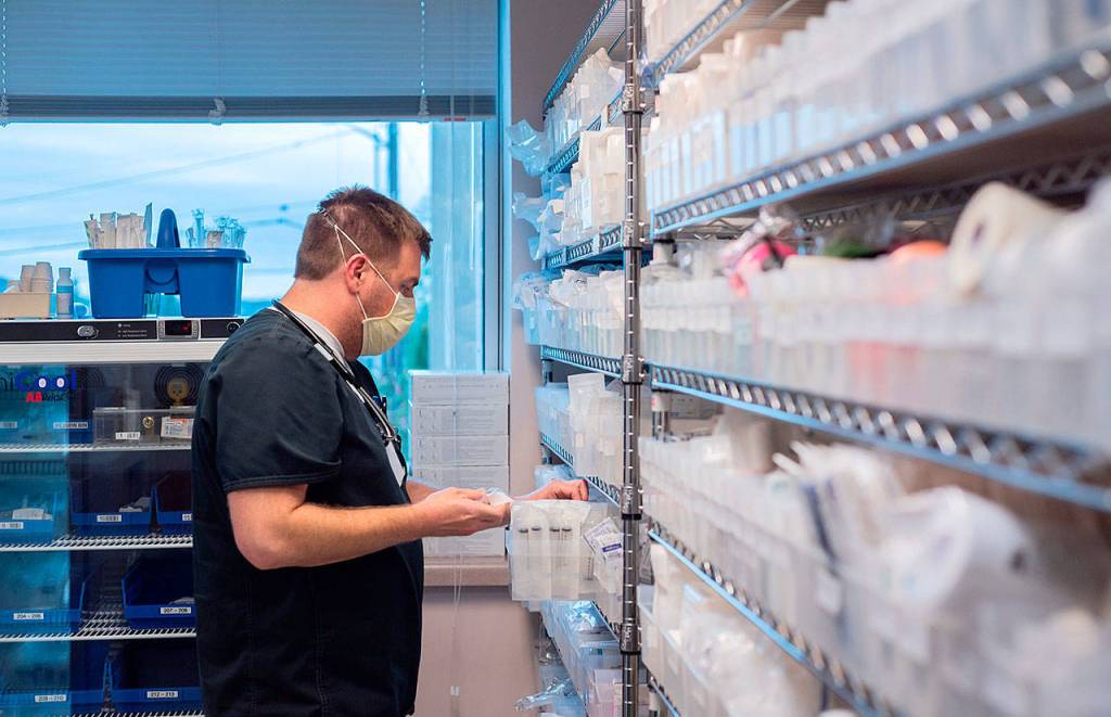 Nurse Chris Stallings retrieves items from a supply room at GHCH.