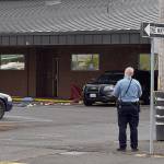DAN HAMMOCK | GRAYS HARBOR NEWS GROUP                                 An officer secures the scene of an officer-involved shooting in the east parking lot of the Aberdeen Police Department Tuesday afternoon.