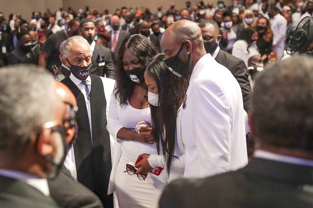 Godofredo A. Vasquez | Getty Images                                Family members react as they view the casket of George Floyd during the private funeral.