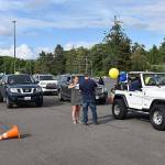 Photos by DAN HAMMOCK | GRAYS HARBOR NEWS GROUP                                More than 200 cars participated in the Aberdeen High School graduation parade Friday. Here cars are assigned numbers for the trek from Shoppes at Riverside to Stewart Field.