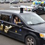 Aberdeen High School Class of 2020 Top Scholar Isabel Rifenberg waves as she and her family depart the Shoppes at Riverside at the beginning of the graduation parade Friday.