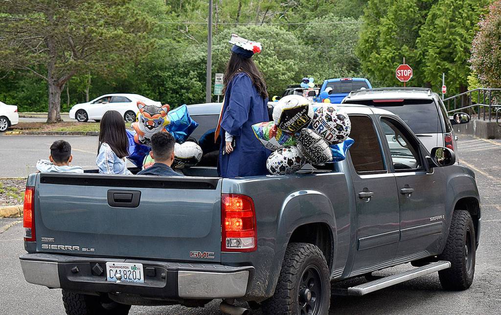The graduation parade for Aberdeen High School Class of 2020 left the Shoppes at Riverside Friday evening, winding through town, past the high school and on to Stewart Field, where graduates and their families were allowed to enter for photos.