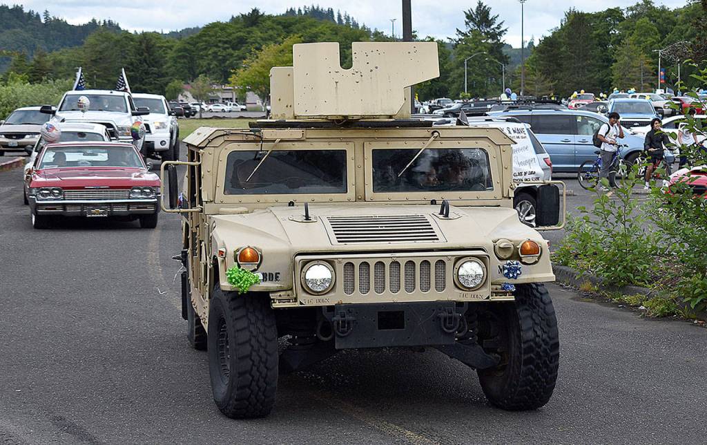 DAN HAMMOCK | GRAYS HARBOR NEWS GROUP                                 There were some unique and elaborately decorated vehicles in the Aberdeen High School graduation parade Friday, including this Hummer, one limousine and several classic cars.