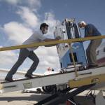 Elliot and Arthur Kreitenberg push the GermFalcon on a plane to disinfect the cabin. (George Sayah/Lunch Break Productions)